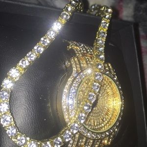 Golden watch and necklace set with diamonds